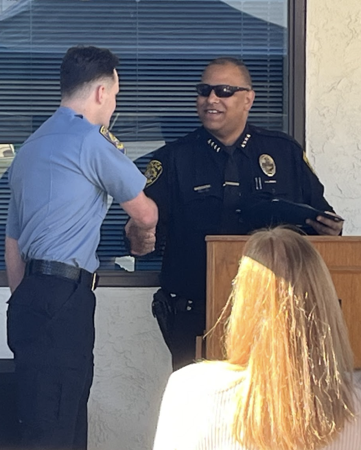 Now former Cuesta College Director of Public Safety Rich Randolph (right) greets graduates at a November 2024 pinning ceremony.